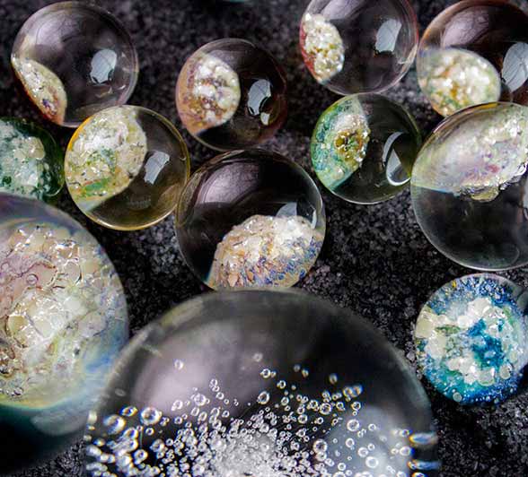 Different sizes and designs of cremation marbles